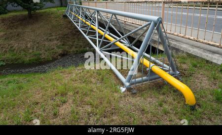 Natural Gas Pipeline Across the creek Stock Photo