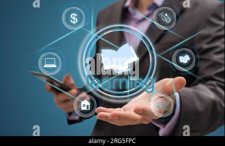 E-Learning Concept. Businessman Holding Holographic World Globe And Text Over Black Background. Collage, Cropped Stock Photo