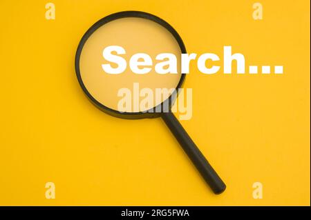 magnifier and search words, concept for searching the internet for information Stock Photo