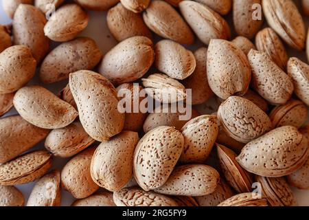 Top of view of whole almonds in the shell. Background of almonds in the shell. Stock Photo