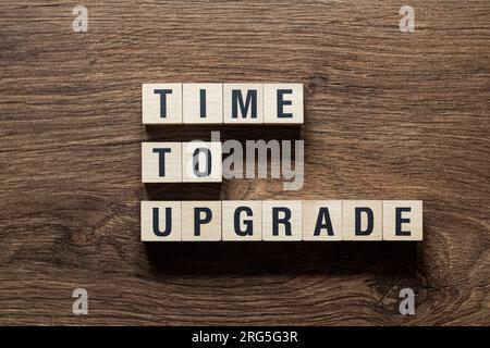Time to upgrade - word concept on building blocks, text Stock Photo