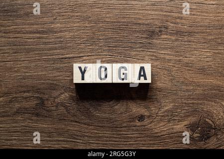 Yoga - word concept on building blocks, text Stock Photo
