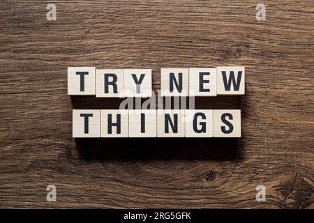 Try new things - word concept on building blocks, text Stock Photo