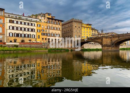 Florence, Ponte Santa Trinita, bridge considered among the most beautiful in Italy,historic buildings in Florence overlooking the Arno River, tuscany, Stock Photo