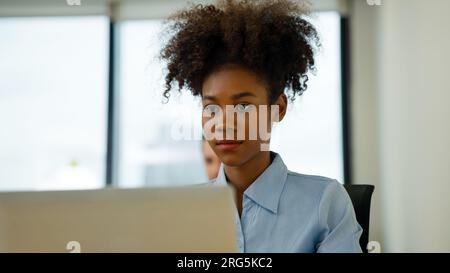 Marketing team using laptop working in company Stock Photo