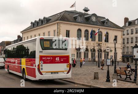 Honfluer, northern France, Europe. 12 June 2023. Red aand white local bus in the town centre of Honfluer a popular tourist town in Normandy region of Stock Photo