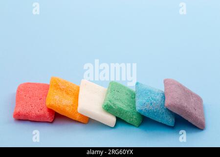 Freeze Dried Candy Fruit Flavored Bar Candies on a Blue Background Stock Photo