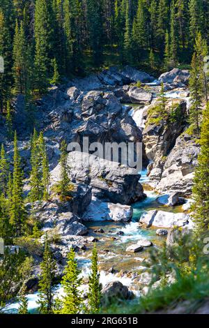 Hummingbird Falls waterfall surrounded by rocks and trees Stock Photo