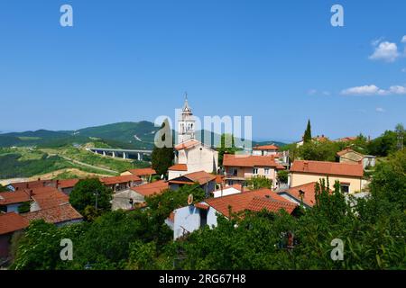 View of Crni Kal village with an old church of St. Valentin in Primorska, Slovenia and the viaduct Stock Photo