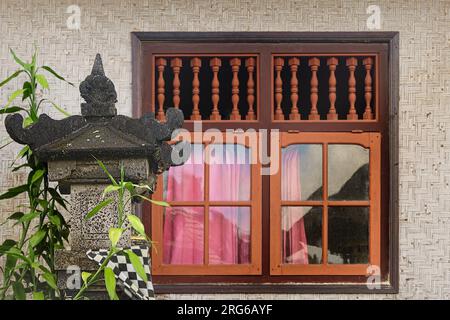 Window in traditional Balinese woven bamboo house with alter, Penglipuran Village, Bangli Regency, Bali, Indonesia Stock Photo