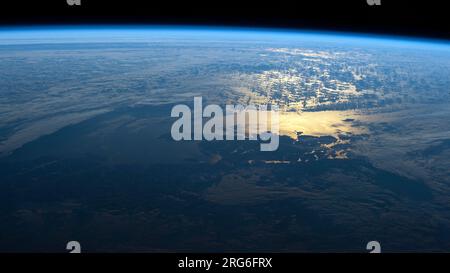 The sun's glint beams off the South Pacific coast of southern Chile's Laguna San Rafael National Park. Stock Photo