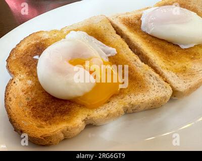 Two poached eggs on toast Stock Photo