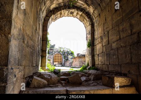 Stone gate of the Greek Roman amphitheater of the city of Umm Qais (Gadara) Irbid, Jordan Stock Photo