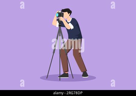 Man photojournalist poses with his photo camera stock photo - OFFSET
