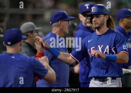 Texas Rangers' Josh Jung catches a ball during spring training baseball  practice Monday, Feb. 20, 2023, in Surprise, Ariz. (AP Photo/Charlie Riedel  Stock Photo - Alamy