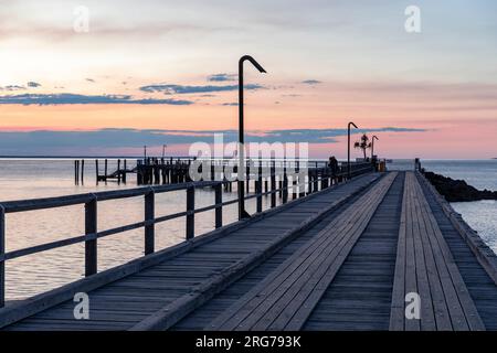 Sunset Fraser Island K'gari over Kingfissher bay and jetty wharf,Queensland,Australia Stock Photo