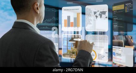 Businessman in the office interacting to augmented reality or virtual touch screen for internet browsing Stock Photo