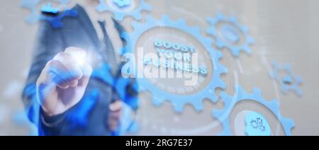 Boost your business on Virtual screen Gears. Business Technology Internet and network concept. Stock Photo