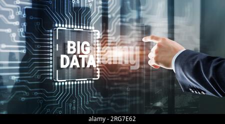 Big data on server racks background. Man clicking on a virtual screen. Stock Photo