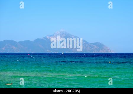 Panoramic view of the turquoise beach of Sarti Chalkidiki Greece and the mountain of Athos in the background Stock Photo