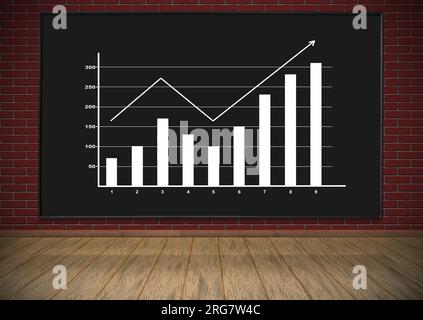 blackboard with drawing chart hanging on red brick wall Stock Photo