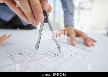 Architect working on drawing table in office Stock Photo
