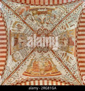 The large cross vault in Ringsted St. Bendt church and four mural paintings from 1275-1300, Ringsted, Denmark, July 29, 2023 Stock Photo