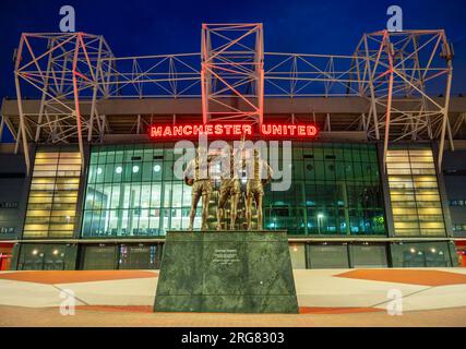 Manchester, United Kingdom. 08.03.2023. Manchester Uniteds Old Trafford Stadium, Trinity Statue taken at Dusk. 3rd August 2023. Stock Photo