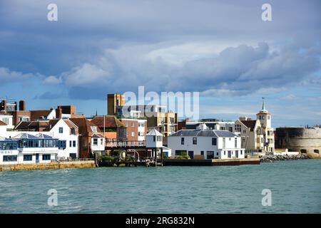 Seafront Old Portsmouth showing historic houses and the round tower part of the 15th-century fortifications in Portsmouth Harbour, Hampshire, England Stock Photo