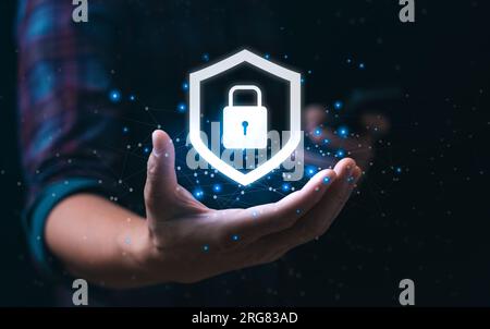 internet security concept and cyber networks. man holding shield icon virtual with lock symbol with network security Stock Photo