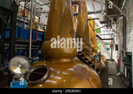 Copper stills in a whisky distillery in Tobermory, Isle of Mull Stock Photo