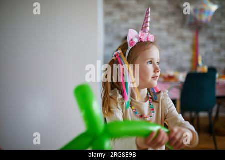 Cute adorable preschooler caucasian kid girl portrait with ski in helmet,  goggles and unicorn fun costume enjoy winter sport activities. Little child  Stock Photo - Alamy