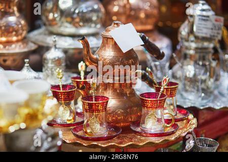 Beautiful tea set on Egyptian Bazaar or Spice Bazaar, one of the largest bazaars in Istanbul, Turkey. Market sells spices, sweets, jewellery, dried fr Stock Photo
