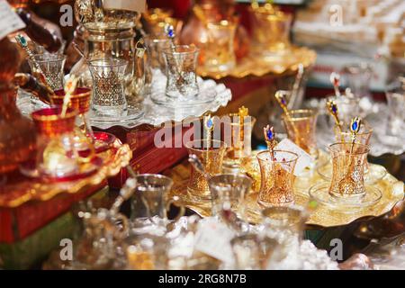Beautiful tea set on Egyptian Bazaar or Spice Bazaar, one of the largest bazaars in Istanbul, Turkey. Market sells spices, sweets, jewellery, dried fr Stock Photo