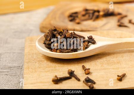 Close up of carnation seeds. Carnation seeds on a wooden background. Stock Photo