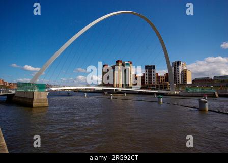 The Gateshead Millennium Bridge. A pedestrian and cyclist tilt bridge spanning the River Tyne Gateshead on the south bank, and the Quayside of Newcastle upon Tyne on the north bank. The award-winning structure was conceived and designed by architects Wilkinson Eyre and structural engineers Gifford. The bridge is often referred to as the 'Winking Eye Bridge' due to its elliptical shape and its rotational movement. Stock Photo