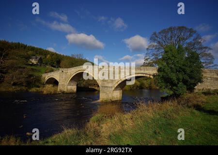 View of Barden Bridge spanning the River Wharfe in the Yorkshire Dales, North Yorkshire. Stock Photo