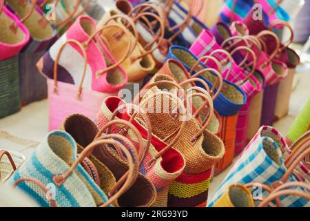 Straw bags on a street market in Cucuron, Provence, France Stock Photo