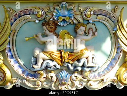 Welland Steam Fair, near Malvern, Worcestershire, with all kinds of farming vehicles and fairground engines on display. Seen here is a close-up of a design of two musical cherubs on a fairground steam organ. Stock Photo