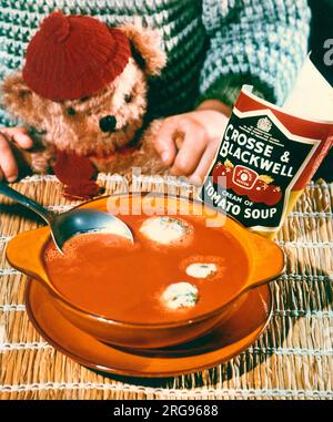 Advertisement for Crosse & Blackwell cream of tomato soup, with child and teddy bear. Stock Photo