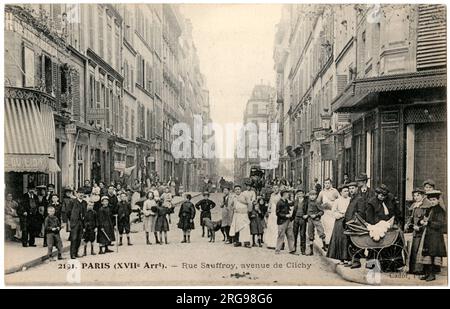 Rue Sauffroy, off the Avenue de Clichy, 17th arrondissement, Paris, France, with a large group of people gathered for the photograph. Stock Photo