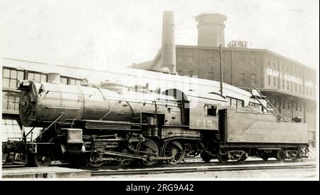 Hillen Station on the Western Maryland Railroad, Baltimore, Maryland, USA, with locomotive and coal truck, and a Sears Roebuck warehouse in the background on the right. Stock Photo