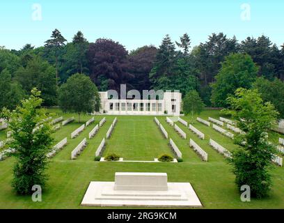 The cemetery lies on an area which was a pre-war drill ground.  It  contains 1,317 UK burials, 564 Australian, 50 Canadian, 167 New Zealand, and 1,703 Unknown, plus 35 Special Memorials. In it is buried Lt Col                                                 H. Scott, DSO 6th AIF, after whom a bunker in the wood is named. The memorial at the far end records the names of 383 New Zealand Missing.  It was designed by Charles Holden. Stock Photo