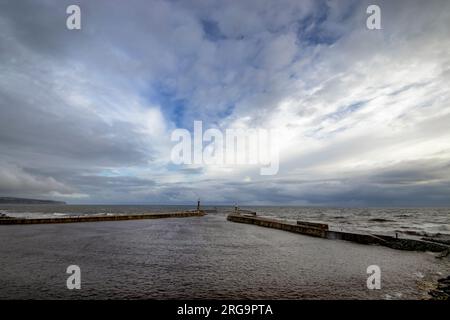 The entrance to Whitby Harbour in North Yorkshire, UK Stock Photo