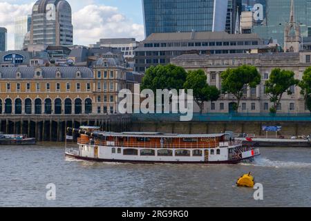 Elizabethan Paddle Steamer on River Thames, with City of London at the background, London, England, UK. Stock Photo