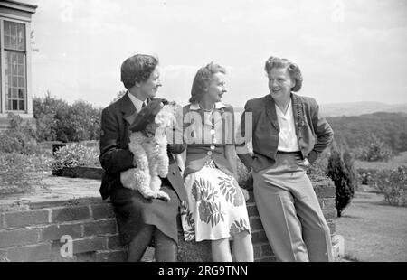 Gracie Fields (1898-1979) - English actress, singer and comedian and star of both cinema and music hall, pictured with friends at Prestbury, after returning from the United States. Stock Photo