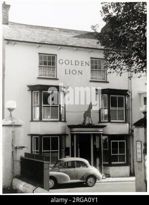 Photograph of Golden Lion PH, Seaton, Devon. The main side of the print (shown here) depicts: Left Face on view of the pub.  The back of the print (available on request) details: Publican ID for the Golden Lion, Seaton, Devon EX12 2LE. As of July 2018 . Now retail use Stock Photo