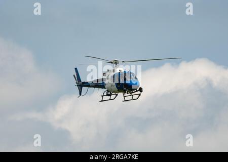 Speck-Fehraltorf, Zurich, Switzerland, July 1, 2023 HB-ZKZ Police Eurocopter AS350-B3 over a small airfield Stock Photo