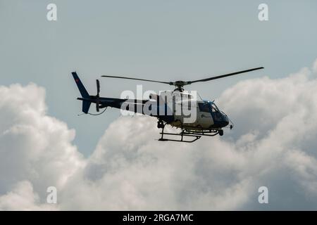 Speck-Fehraltorf, Zurich, Switzerland, July 1, 2023 HB-ZKZ Police Eurocopter AS350-B3 over a small airfield Stock Photo