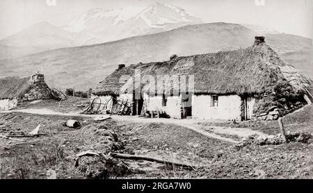 Vintage 19th century photograph: The blacksmith or farrier's smithy at Kinlochchewe Ross-shire Scotland thatched roof Stock Photo